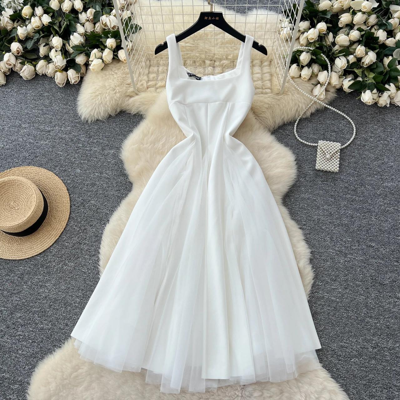 Sleeveless White Dress With Flowy Tulle Skirt